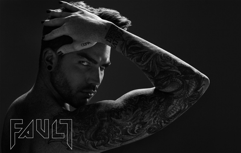 Adam Lambert shows off his tattoo sleeve for Fault magazine.