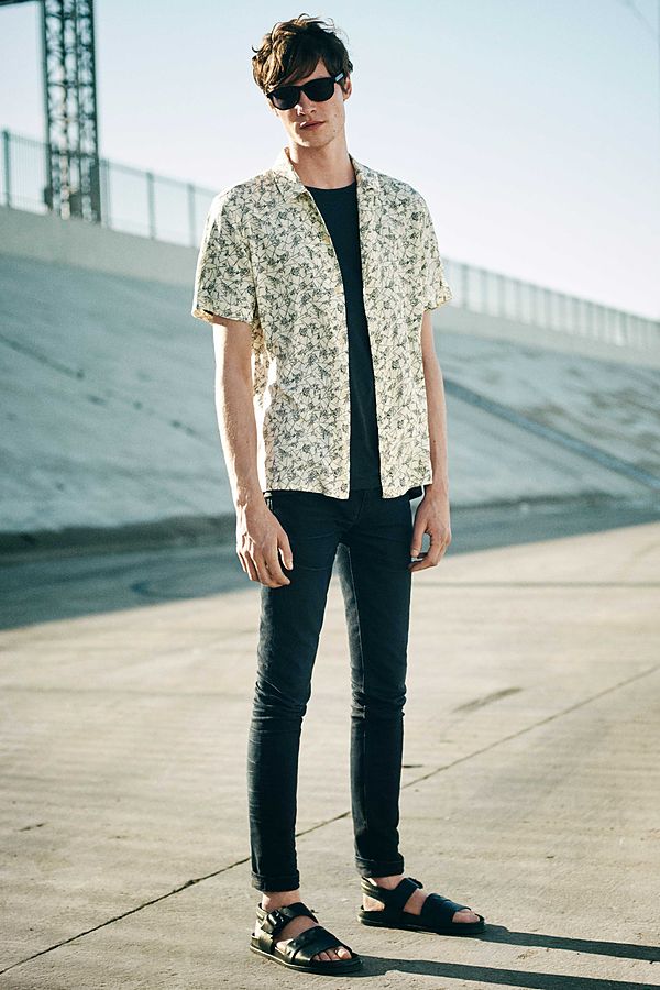 Matthew heads outdoors, updating a slim, simple black look with a light printed short-sleeve shirt.