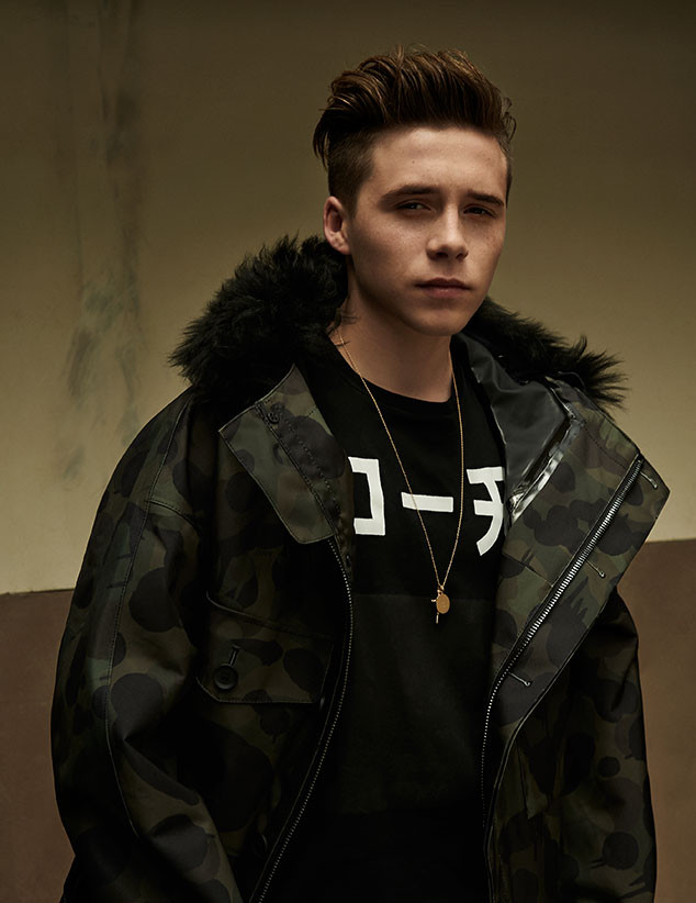 Brooklyn Beckham has a c amouflage moment in a winter parka.