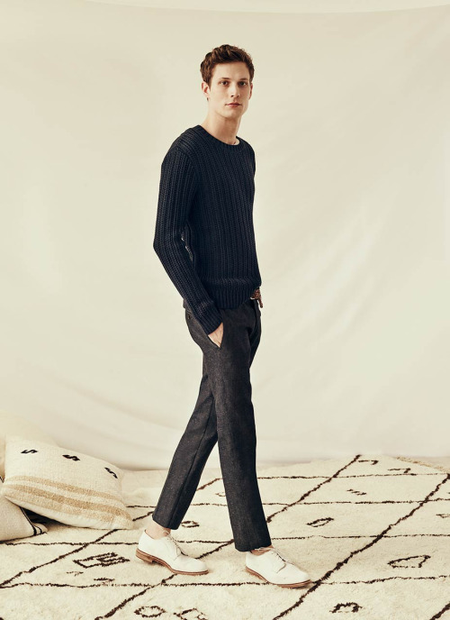 Felix wears Club Monaco rib crewneck sweatshirt with linen trousers and Allen Edmonds blucher shoes.