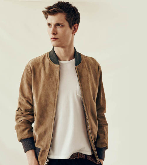 Felix wears Club Monaco suede bomber jacket and a pocket crew tee.