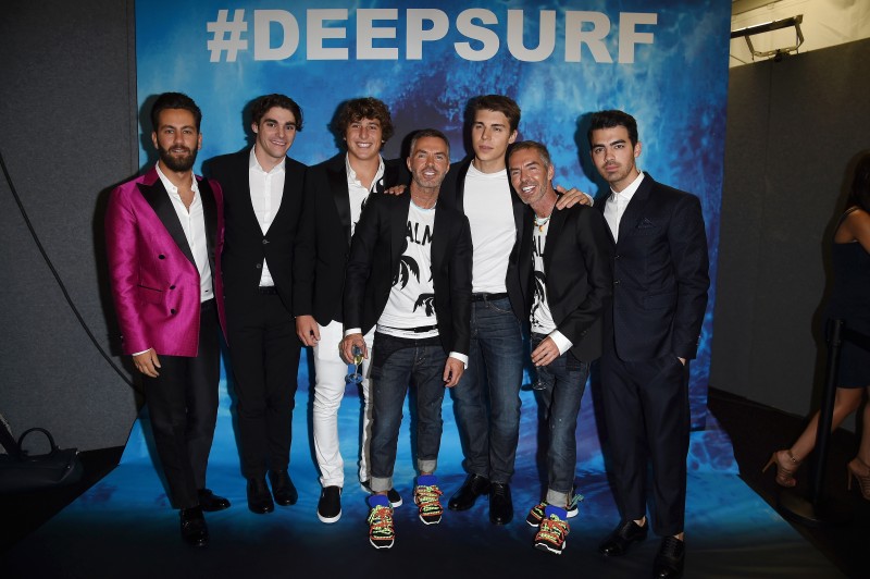 MILAN, ITALY - JUNE 23:  Matthew Zorpas, RJ Mitte , Leonardo Fioravanti, Dean Caten, Nolan Gerard Funk, Dan Caten and Joe Jonas attends the Dsquared2 show during the Milan Men's Fashion Week Spring/Summer 2016 on June 23, 2015 in Milan, Italy.  (Photo by Venturelli/Getty Images for Dsquared2) Matthew Zorpas;RJ Mitte;Leonardo Fioravanti;Dean Caten;Nolan Gerard Funk;Dan Caten;Joe Jonas