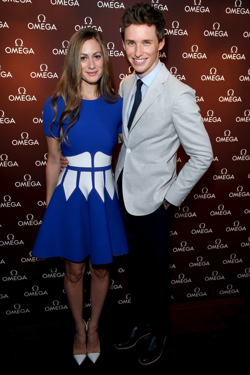Eddie Redmayne poses for a photo with his wife Hannah