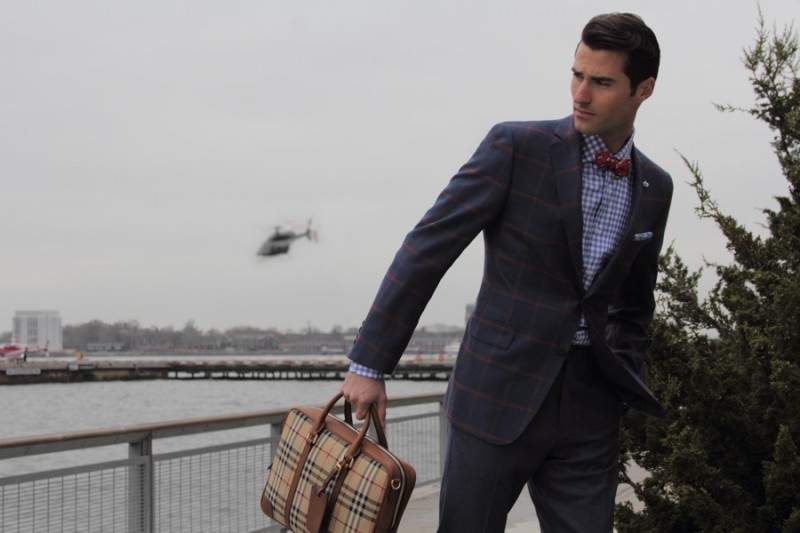 Alessandro wears dress shirt VK Nagrani, bag Burberry, bow-tie and tie pin Fine and Dandy, jacket and trousers Samuelsohn.