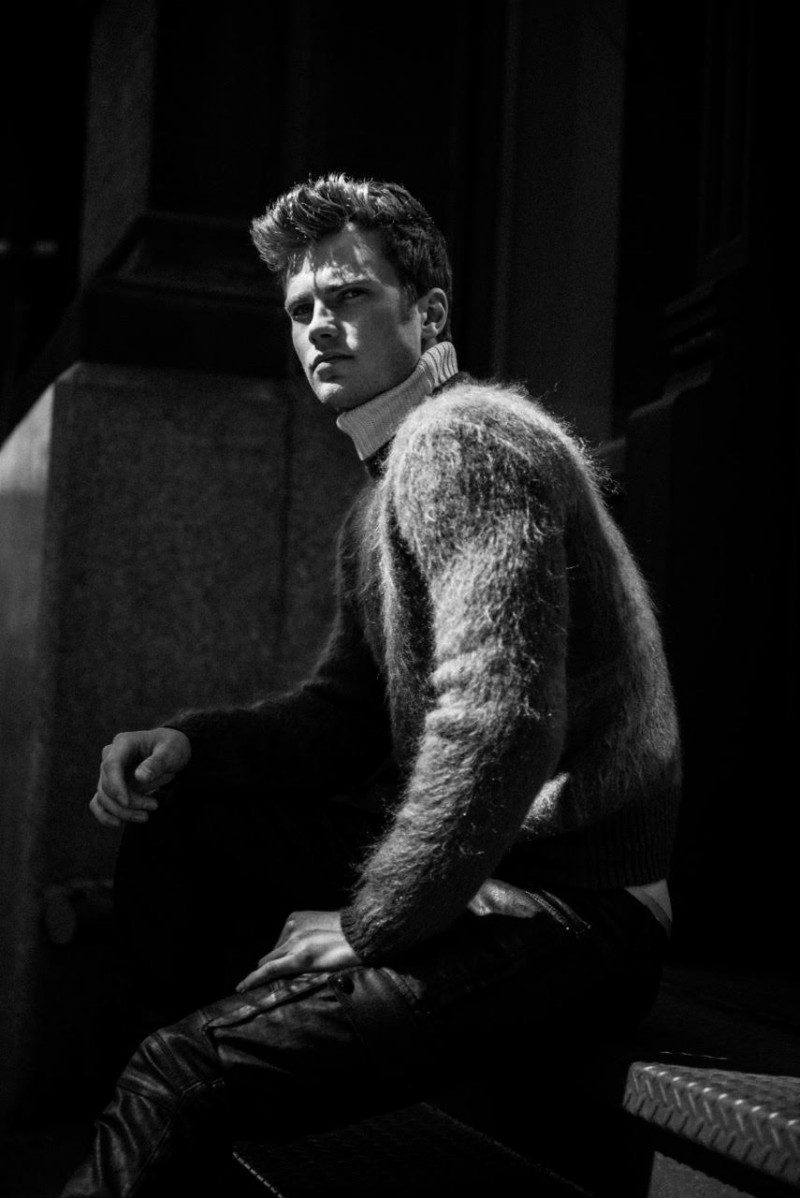 Having a quiet moment, Bobby poses in a luxe Belstaff knit.