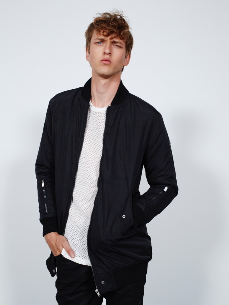 Dimitrij wears top River Island, bomber jacket Boohoo and jeans GUESS.
