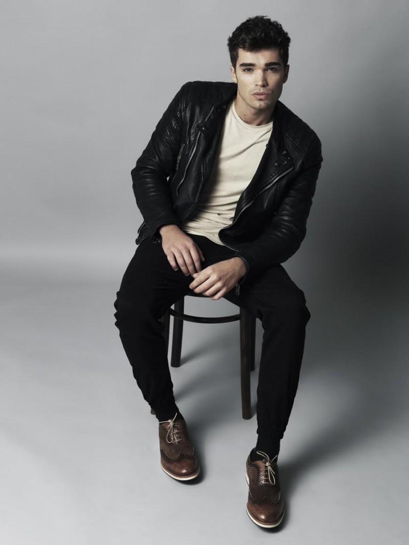 Josh wears leather jacket Burberry, t-shirt Underated, pants Publish Brand and shoes Foxhall London.