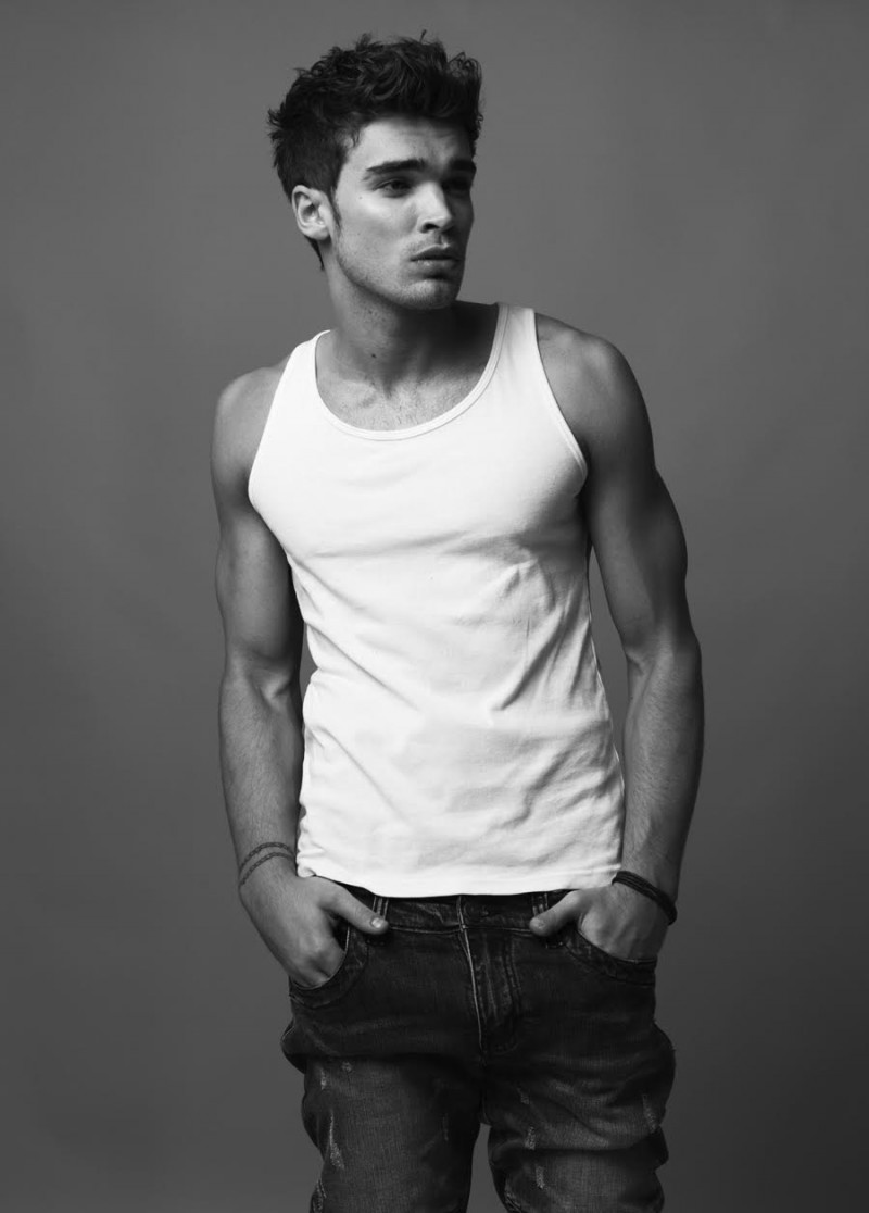 Josh wears jeans Underated and tank Dolce & Gabbana.