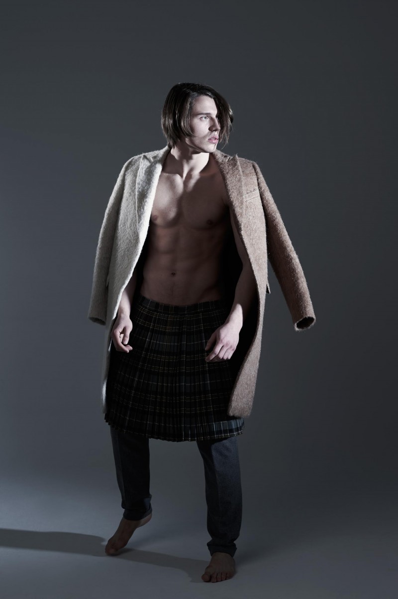 Johannes wears coat Au Jour Le Jour, vintage skirt Archivi Mazzini and trousers Manuel Ritz.