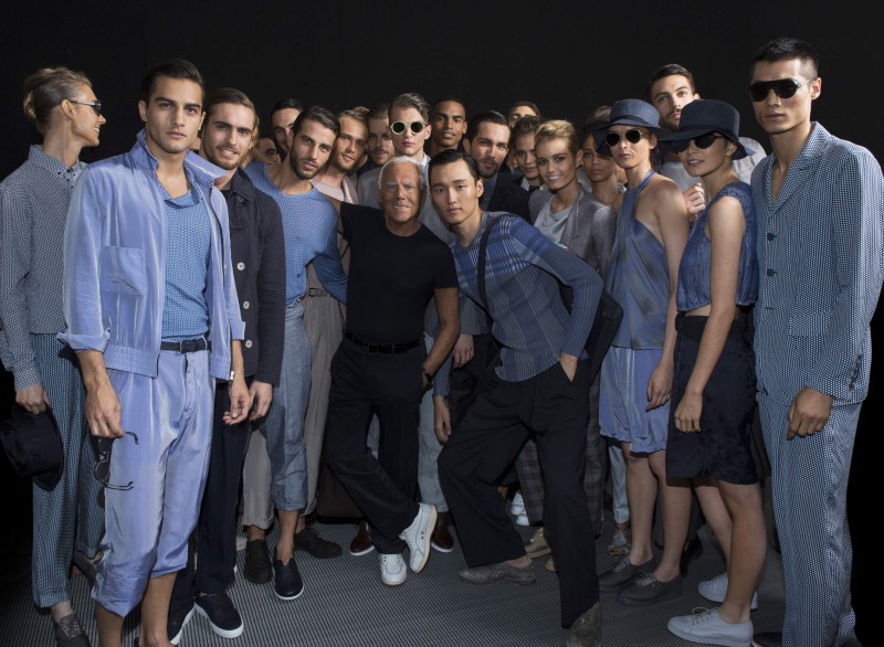 Giorgio Armani poses with the models who walked his spring-summer 2016 menswear show.