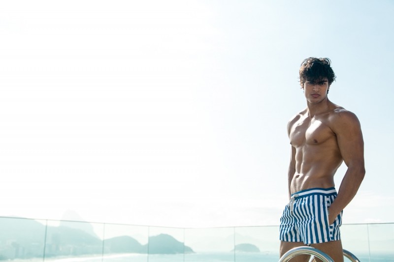 Sporting striped swim shorts, Iago is styled by fashion editor Joseph Kocharian.