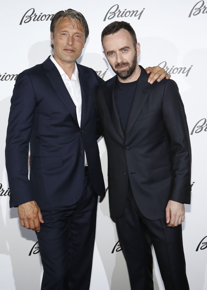 Mads Mikkelsen and Brioni creative director Brendan Mullane pose for pictures at the brand's spring-summer 2016 menswear show.