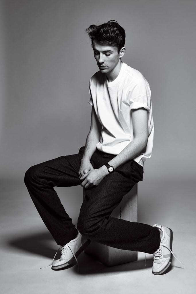 Matthew Beard wears t-shirt Louis Vuitton, trousers Joseph and sneakers Rag & Bone.