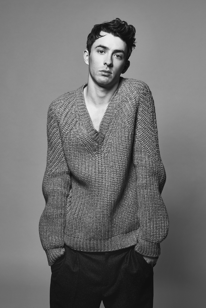 Matthew Beard wears sweater Brinoi and trousers Joseph.