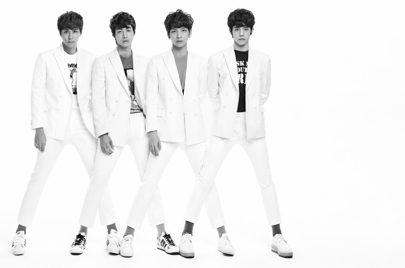 N.Flying are chic in white suits.