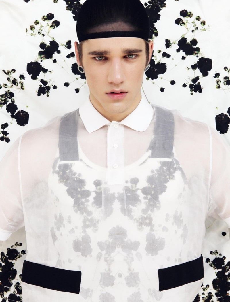 Simon Miskech goes sheer in Givenchy.