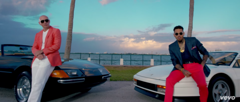 Pitbull and Chris Brown embrace Miami Vice inspired looks for their Fun music video.