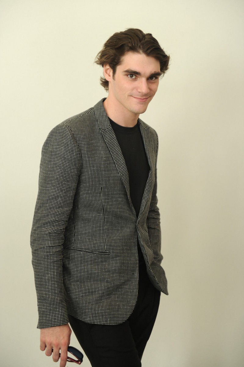 RJ Mitte poses for a photo at Emporio Armani's spring-summer 2016 show.