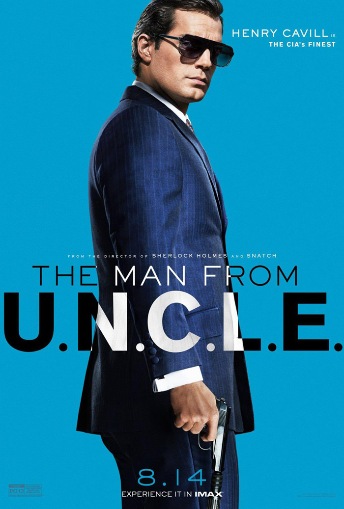 Henry Cavill is dashing in a blue suit and sunglasses for The Man from U.N.C.L.E. movie poster.
