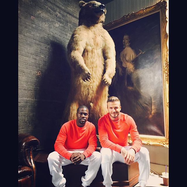 Kevin Hart shares another picture with David Beckham: "2 questions...Question #1Why are we sitting this comfortably In Front of this grizzly bear? Question #2 Why are we dressed alike? Gotta love @davidbeckham #Twins #GoodTimesWithGreatPeople"