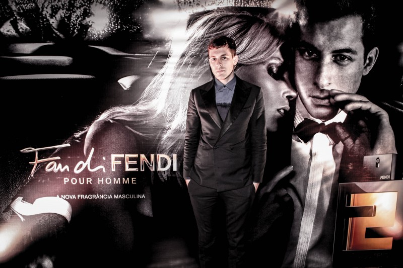 Mark Ronson poses with a large image of his Fan di Fendi campaign