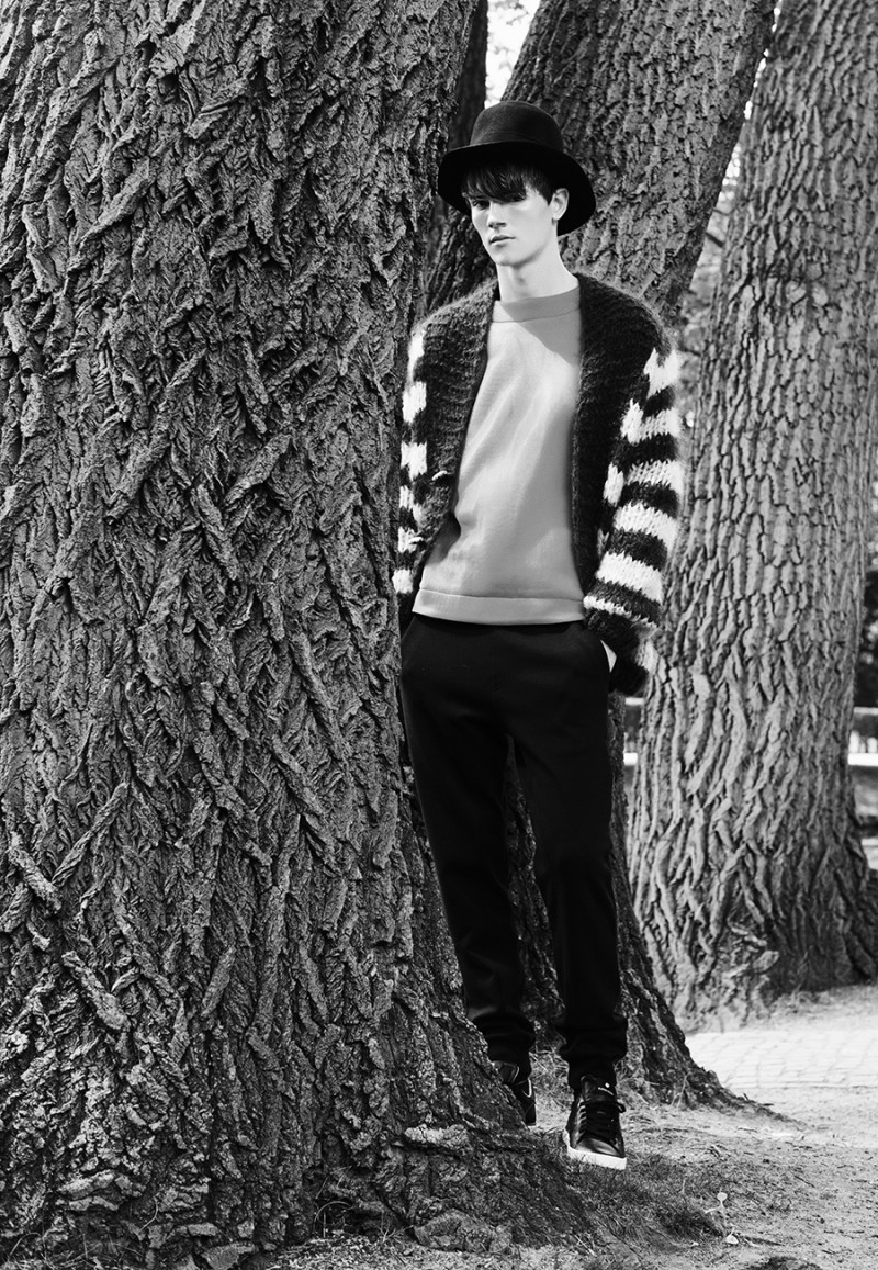Callum wears pants Element, pullover Tosca Wyss by Blank Etiquette, cardigan Miami, hat Henrik Vibskov and shoes Bjorn Borg.