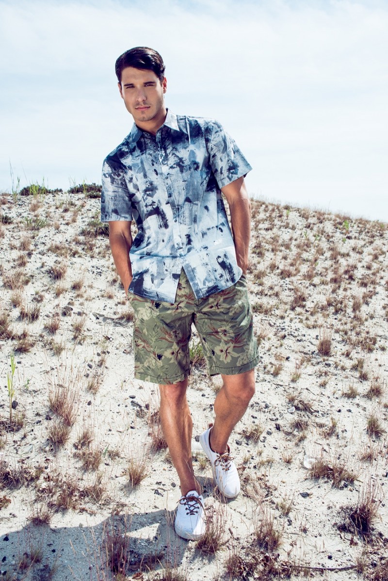 Cody wears shirt PS by Paul Smith, shorts Tommy Hilfiger and shoes Creative Recreation.