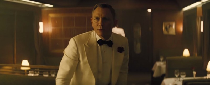 James Bond (Daniel Craig) is dressed to kill in a white tuxedo.