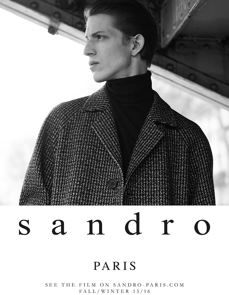 Xavier Buestel models a chic coat and turtleneck look for Sandro's fall-winter 2015 advertising campaign.