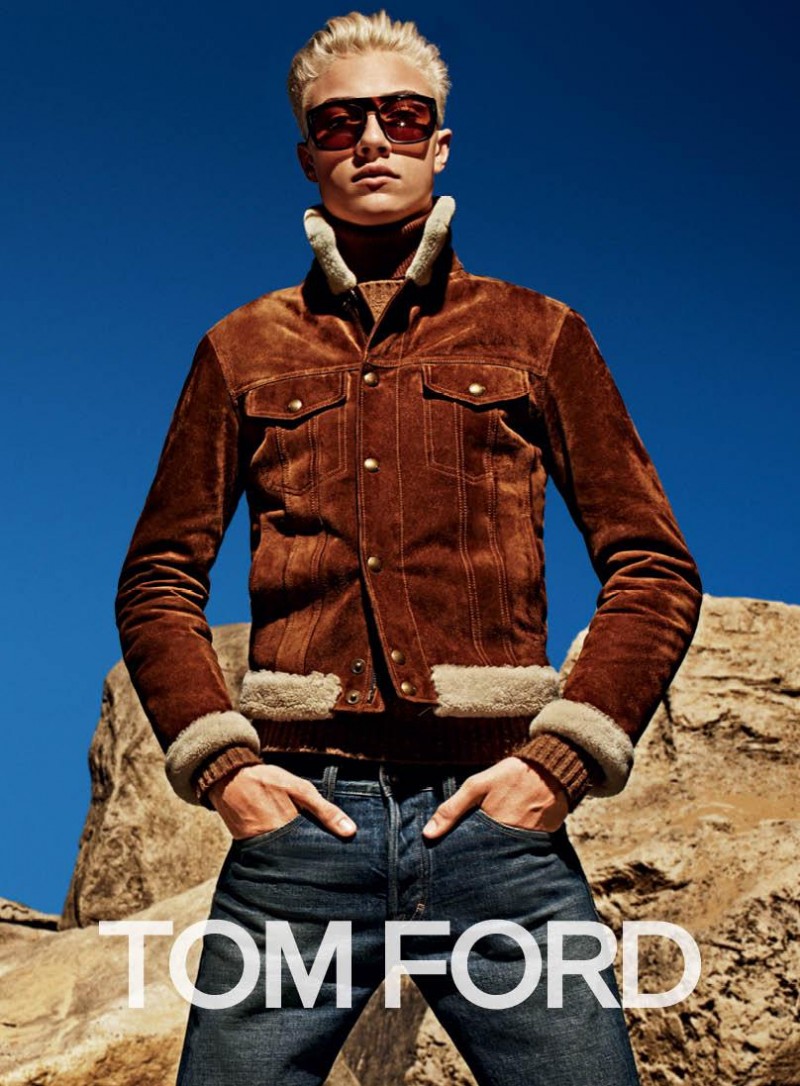 Lucky Blue Smith models a rich brown suede and shearling jacket with denim jeans for Tom Ford's fall-winter 2015 advertising campaign.