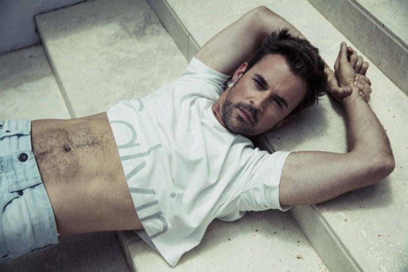 Brad Goreski sports a Calvin Klein cropped top for his Attitude shoot.