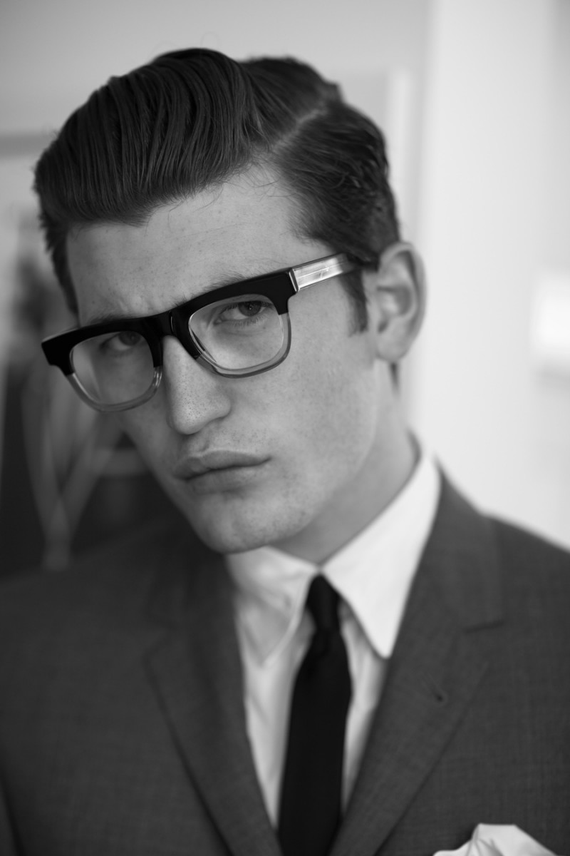 Dylan wears glasses RetroSuperfuture, suit Thom Browne for Black Fleece, tie Dior Homme and shirt Public School.