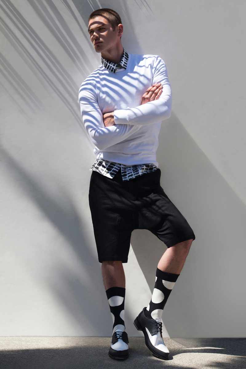 James wears socks Happy Socks, shoes John Fluevog, sweater, shorts and shirt Helmut Lang.