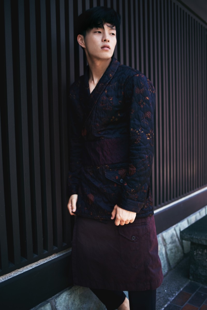 Satoshi wears trousers AllSaints, wrap-front jacket and kilt Dries Van Noten.