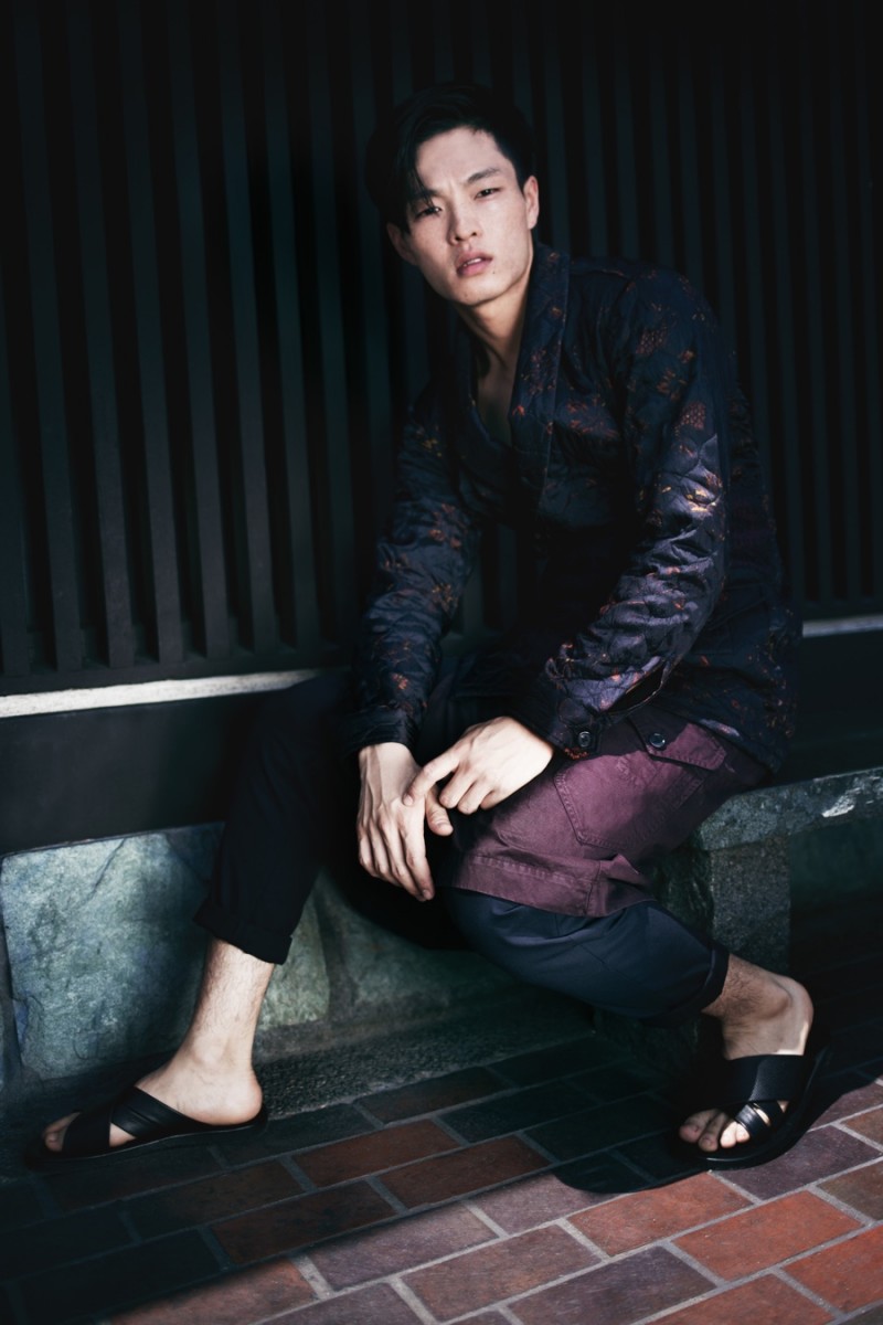 Satoshi wears trousers AllSaints, sandals Saks Fifth Avenue Collection, wrap-front jacket and kilt Dries Van Noten.