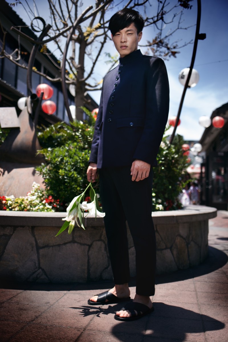 Satoshi wears reversible jacket Dries Van Noten, trousers AllSaints and sandals Saks Fifth Avenue Collection.