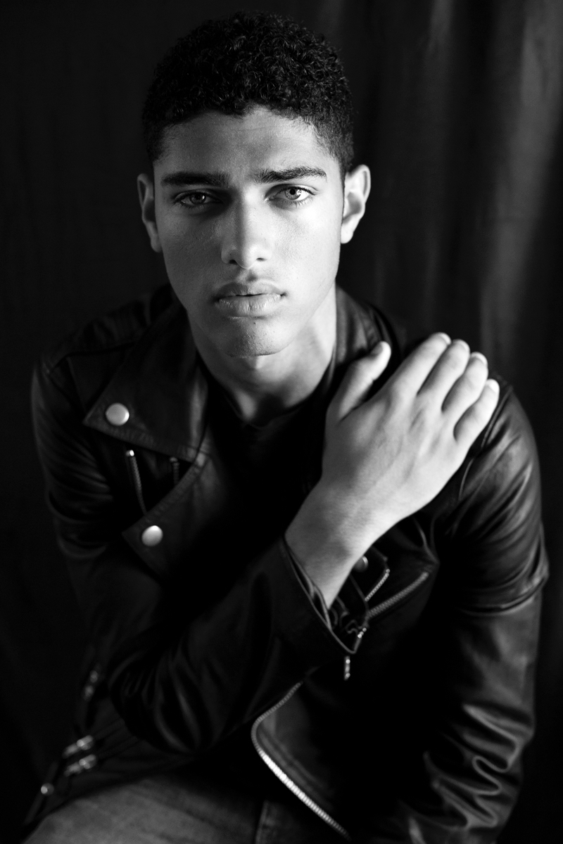 Torin wears leather biker jacket and denim jeans BLK DNM.