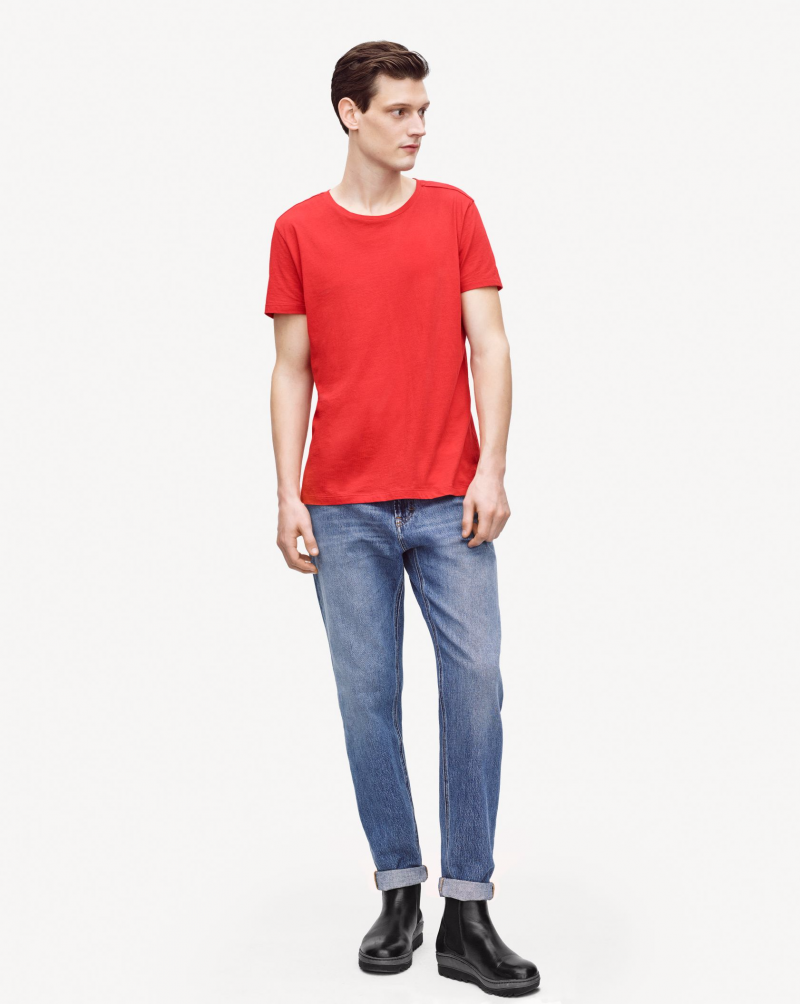 Adam Butcher goes relaxed in a red tee.