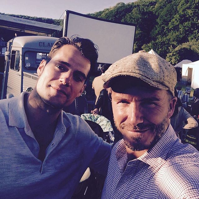 Henry Cavill and David Beckham pose for a selfie together.