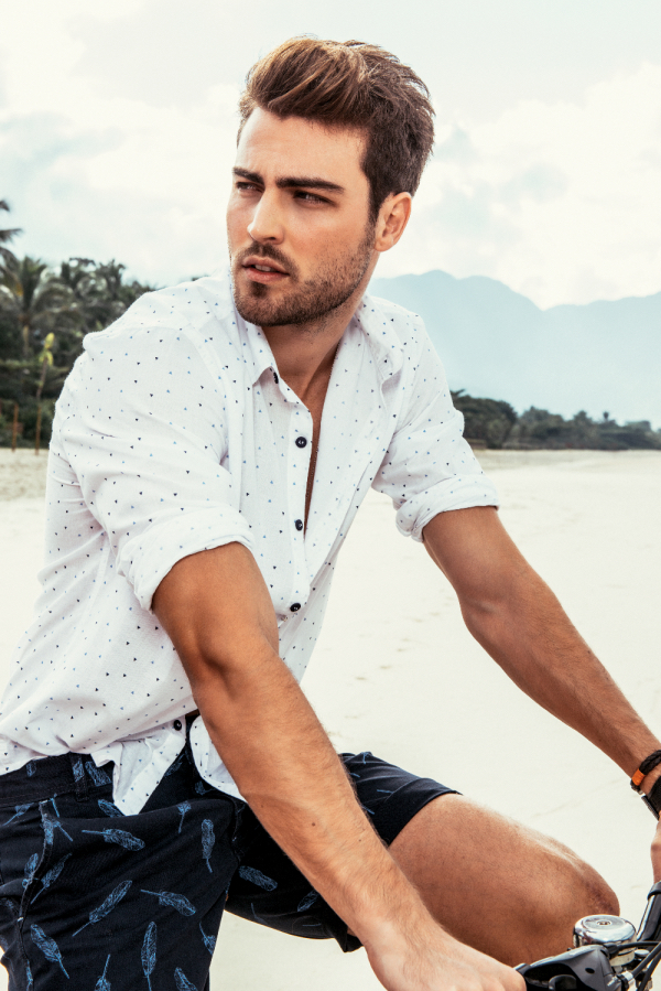 Matheus de David embraces casual style in a pair of printed shorts.