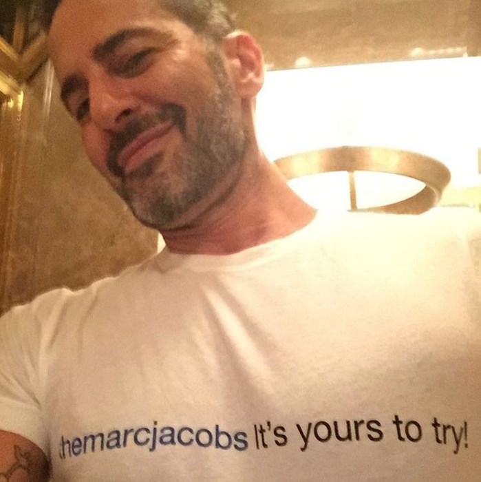 Marc Jacobs shows off his new t-shirt poking fun at his nude scandal.
