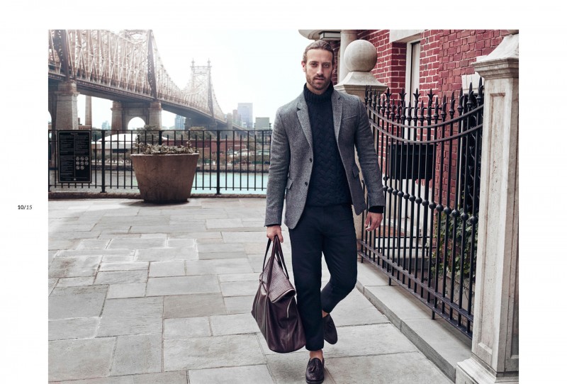 Matthew Avedon heads out in a chic turtleneck and gray blazer.