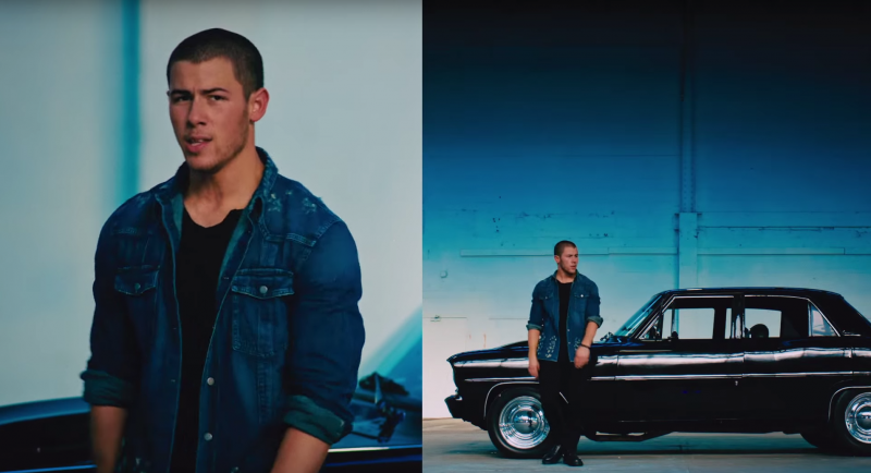 Nick Jonas rocks a distesssed denim shirt with black jeans.