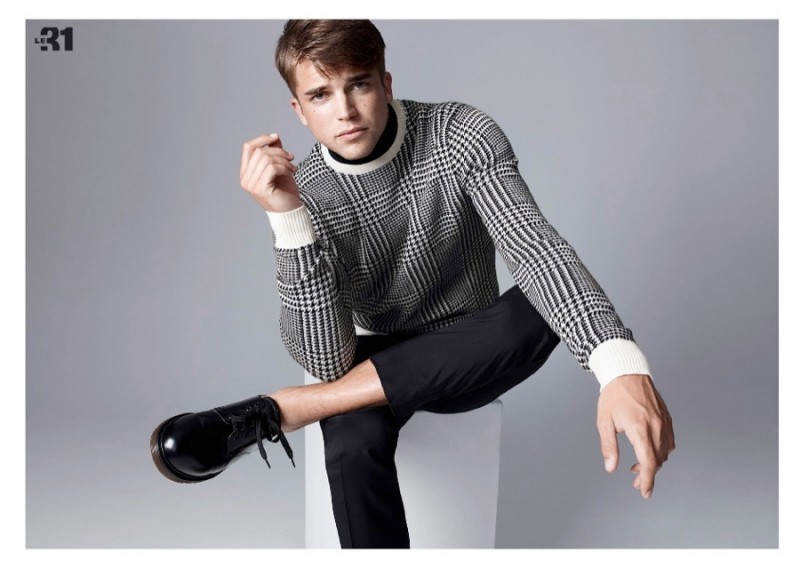 Model River Viiperi rocks a houndstooth print sweater for Simons.