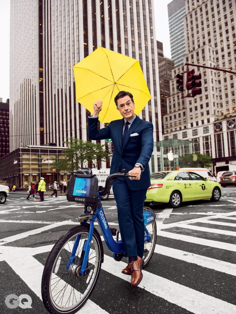 Stephen Colbert cleans up in a navy suit as he tackles New York City on a Citi bike.