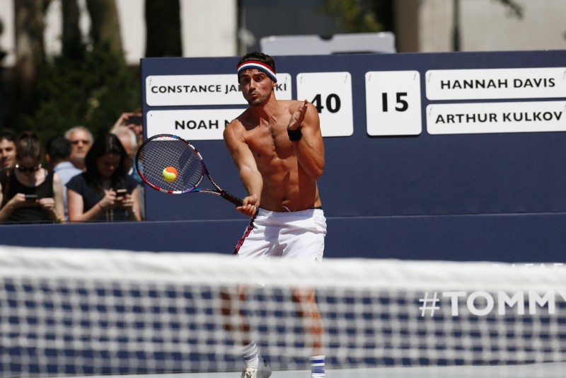 Arthur Kulkov goes shirtless as he plays a game of tennis.