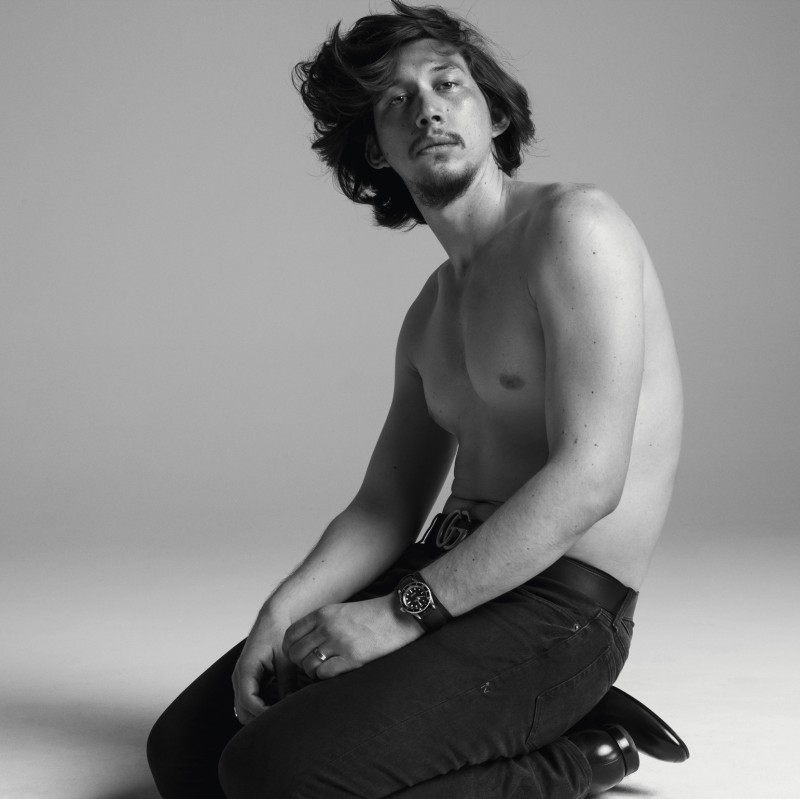 Adam Driver goes shirtless, rocking a pair of denim jeans and a Gucci belt.
