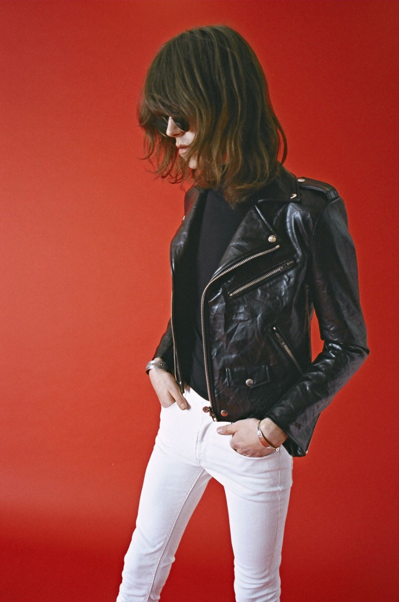 Harry Curran dons a skinny silhouette, wearing white jean with a leather biker jacket.