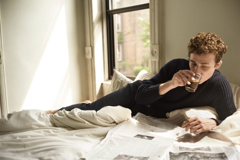 Sporting a Tom Ford number, Ben Rosenfield relaxes in bed.