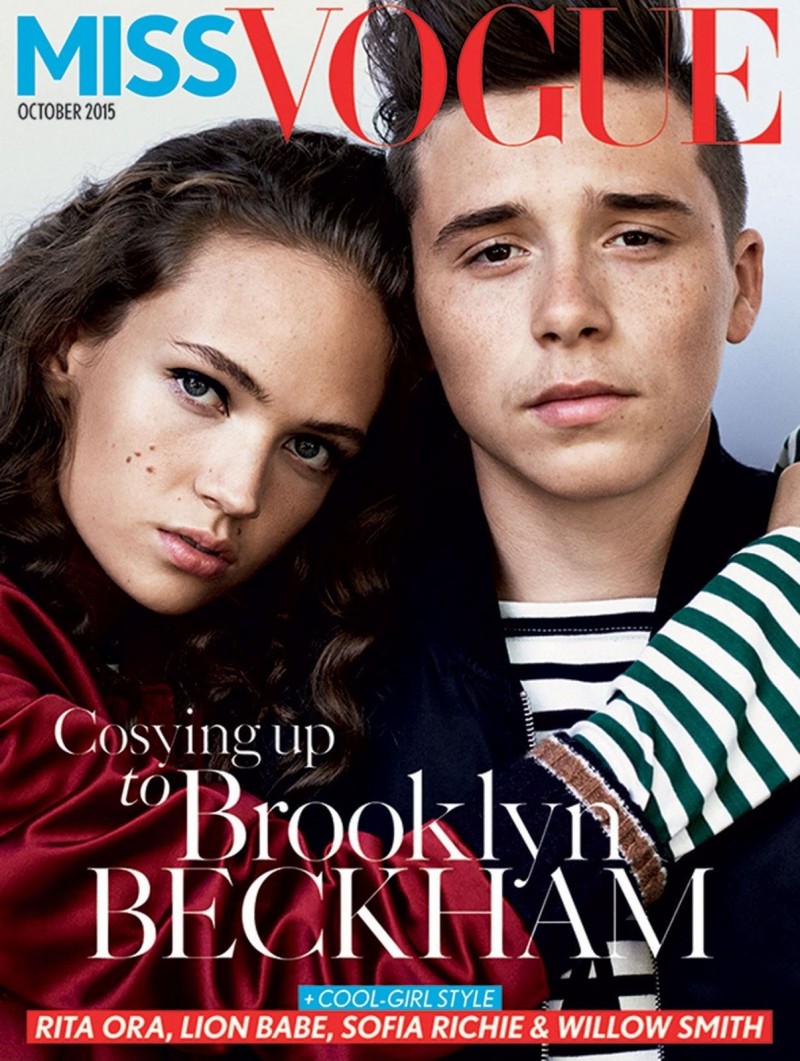 Brooklyn Beckham joins model Adrienne Jüliger for the October 2015 cover of Miss Vogue. Photographed by Daniel Jackson, Beckham is styled by Kate Phelan in a youthful wardrobe.